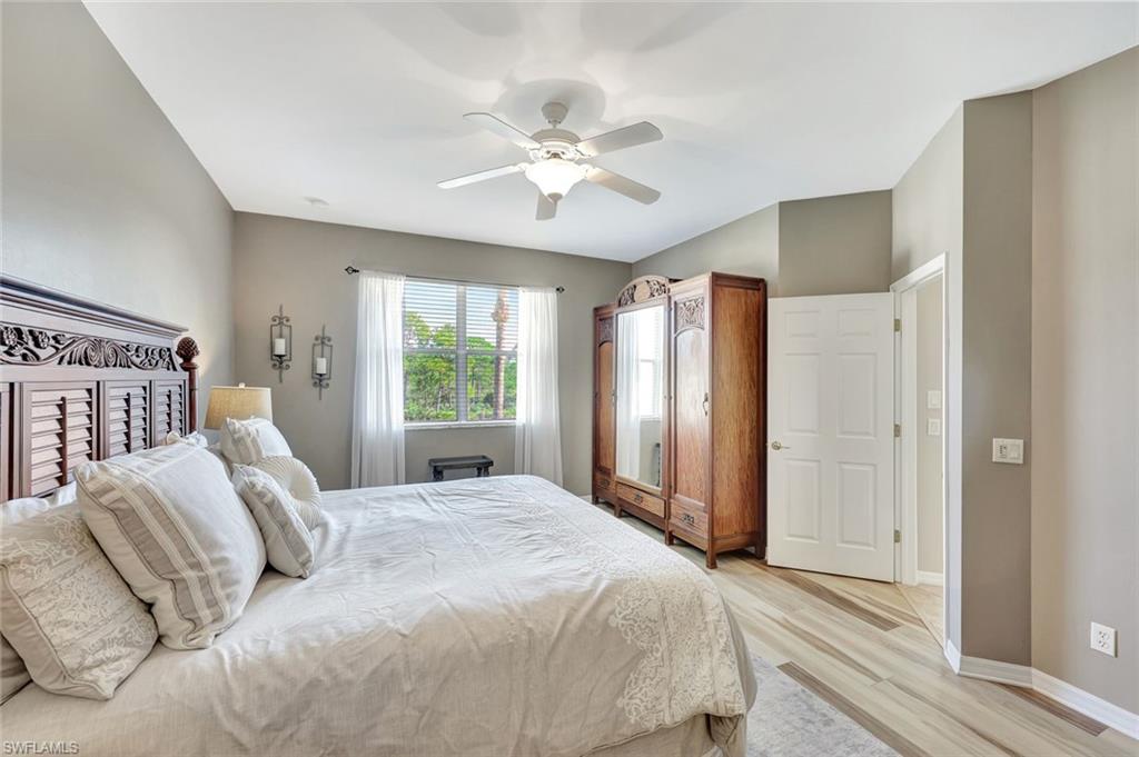 9110 Spanish Moss Way, Unit 422 Bonita Springs, FL 34135 - Photo 13 of 20 a bedroom with a large bed and a window