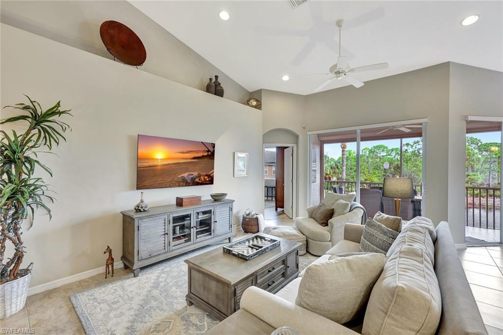 9110 Spanish Moss Way, Unit 422 Bonita Springs, FL 34135 - Photo 3 of 20 a living room with furniture and a flat screen tv