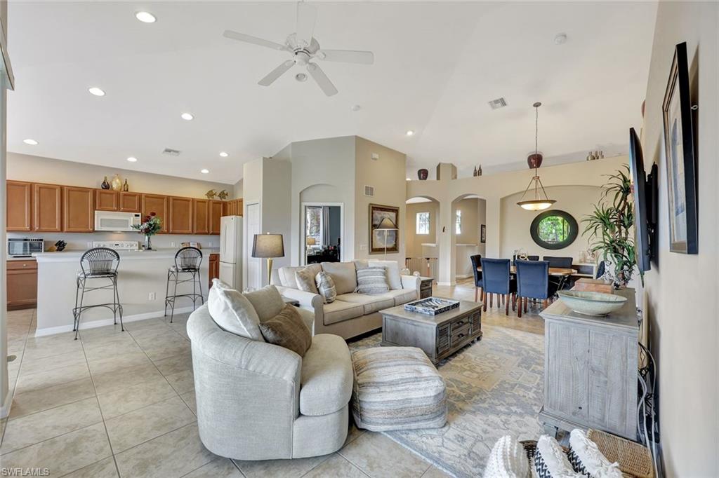 9110 Spanish Moss Way, Unit 422 Bonita Springs, FL 34135 - Photo 5 of 20 a living room with fireplace furniture and a view of kitchen