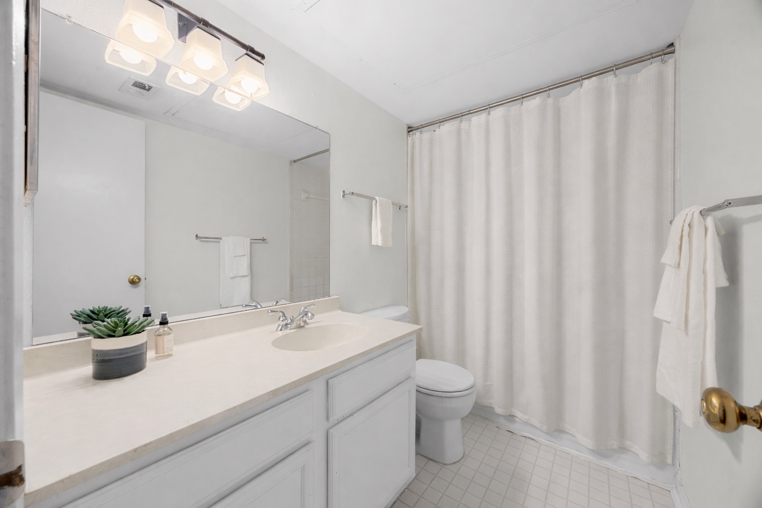 4159 Steck Avenue, Unit 258 Austin, TX 78759 - Photo 21 of 28 a bathroom with a sink a toilet and a mirror