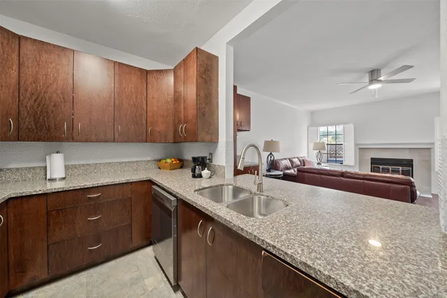 a spacious bedroom with a bed and a flat screen tv