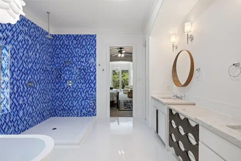 a bathroom with a sink a toilet and a shower