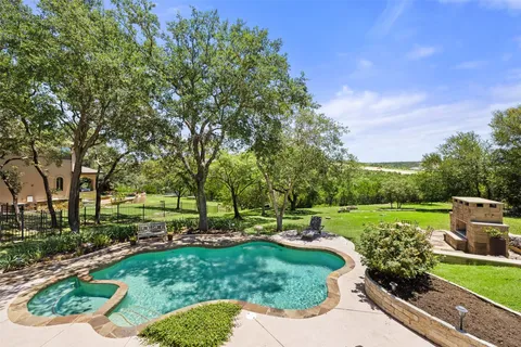 a view of a park with large trees