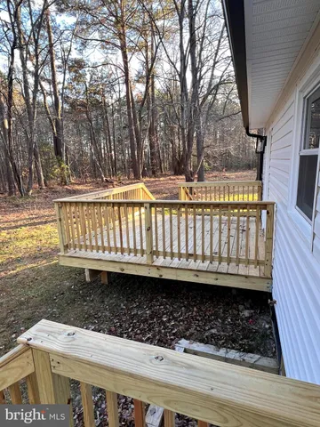 a view of balcony with wooden floor