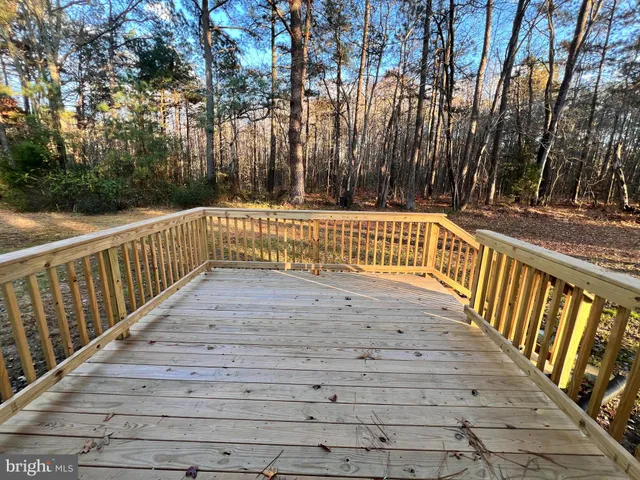 a view of outdoor space with deck and yard