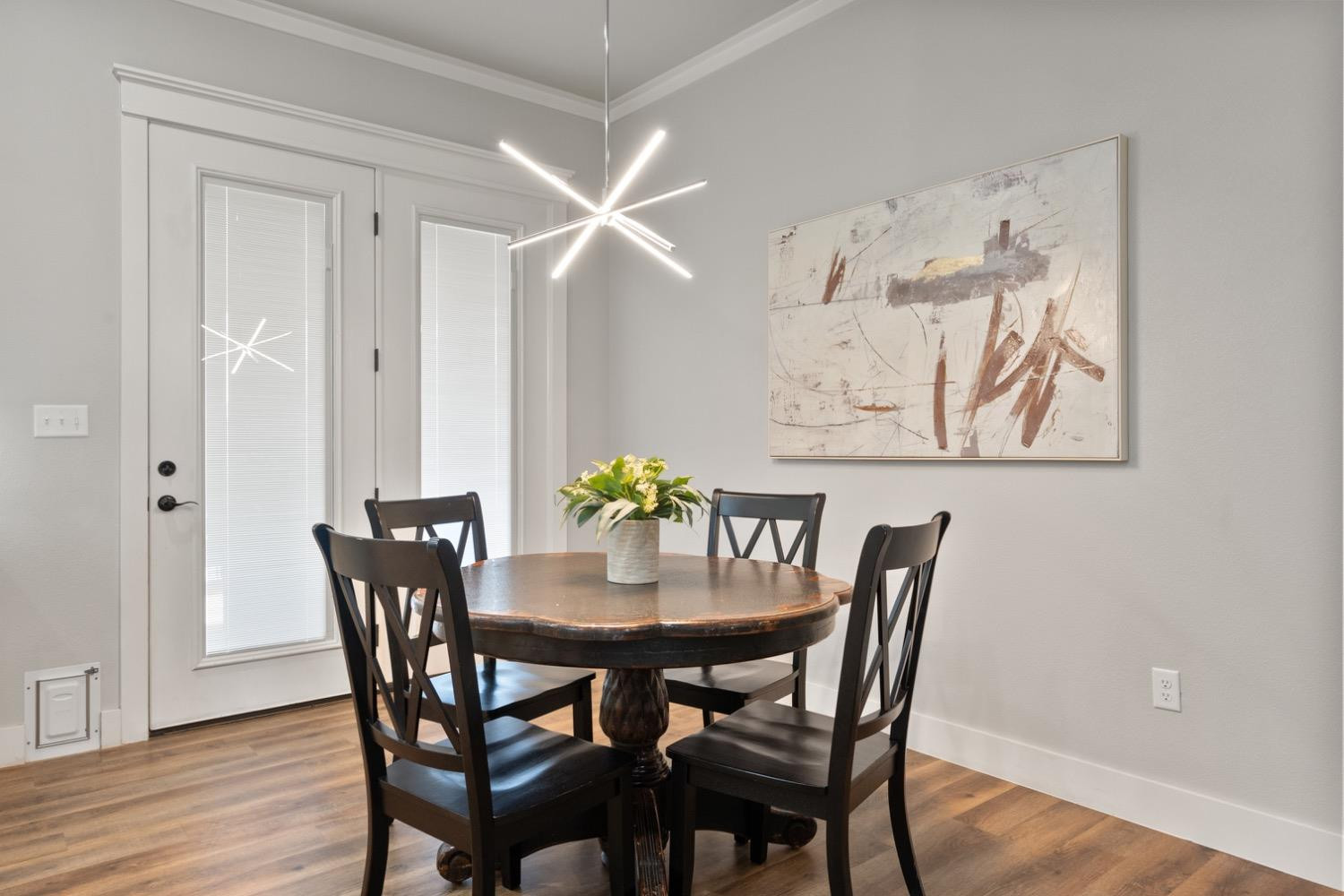 7805 52nd Street Lubbock, TX 79407 - Photo 15 of 32 a view of a dining room with furniture and wooden floor