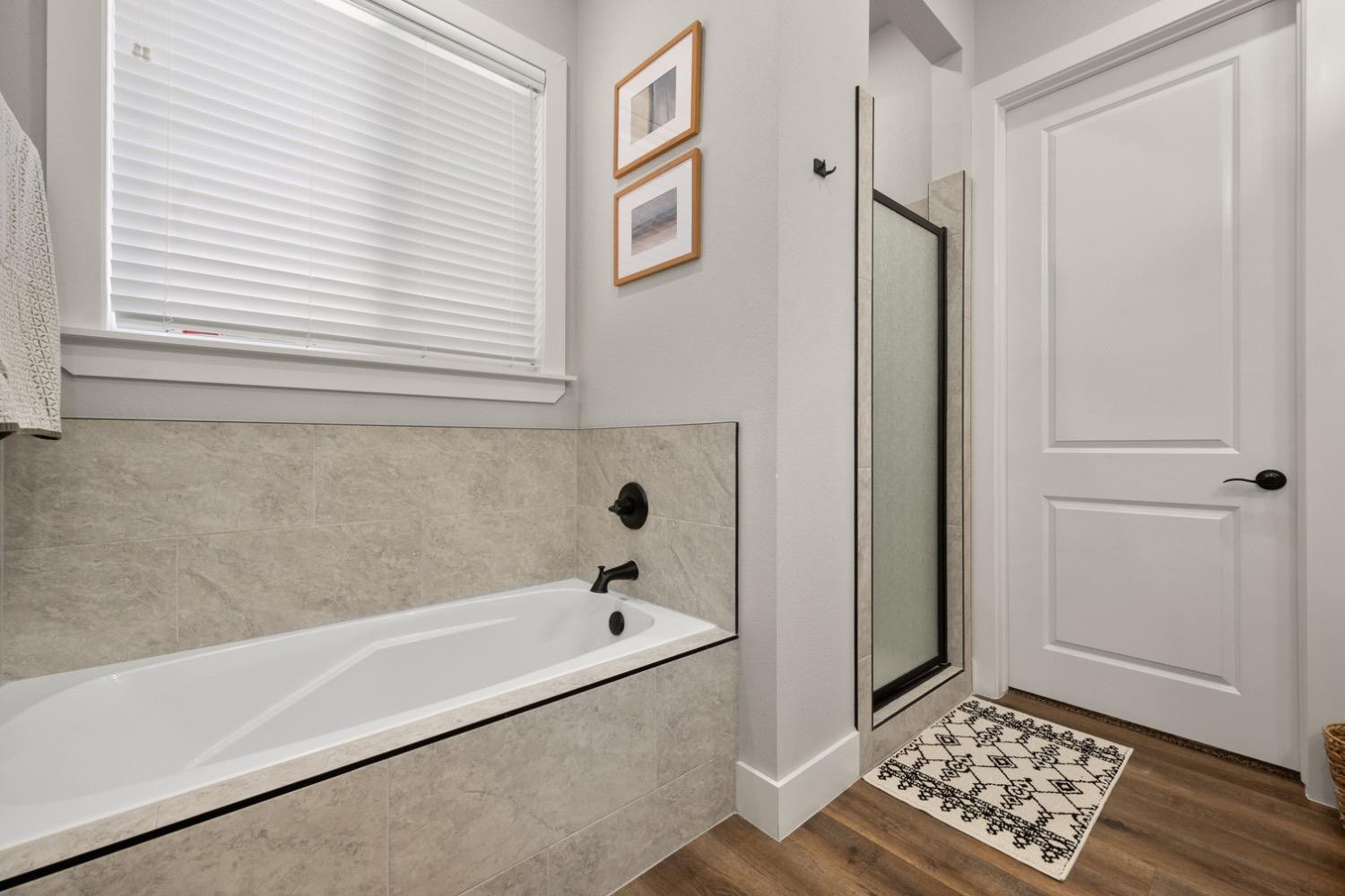 7805 52nd Street Lubbock, TX 79407 - Photo 22 of 32 a bathroom with a bathtub and a window