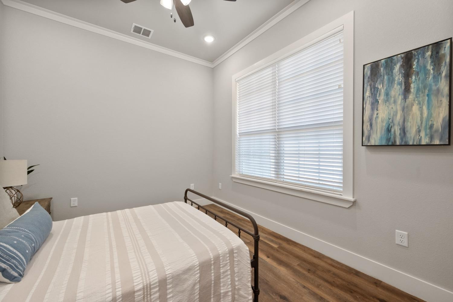 7805 52nd Street Lubbock, TX 79407 - Photo 27 of 32 a bedroom with a bed and a window