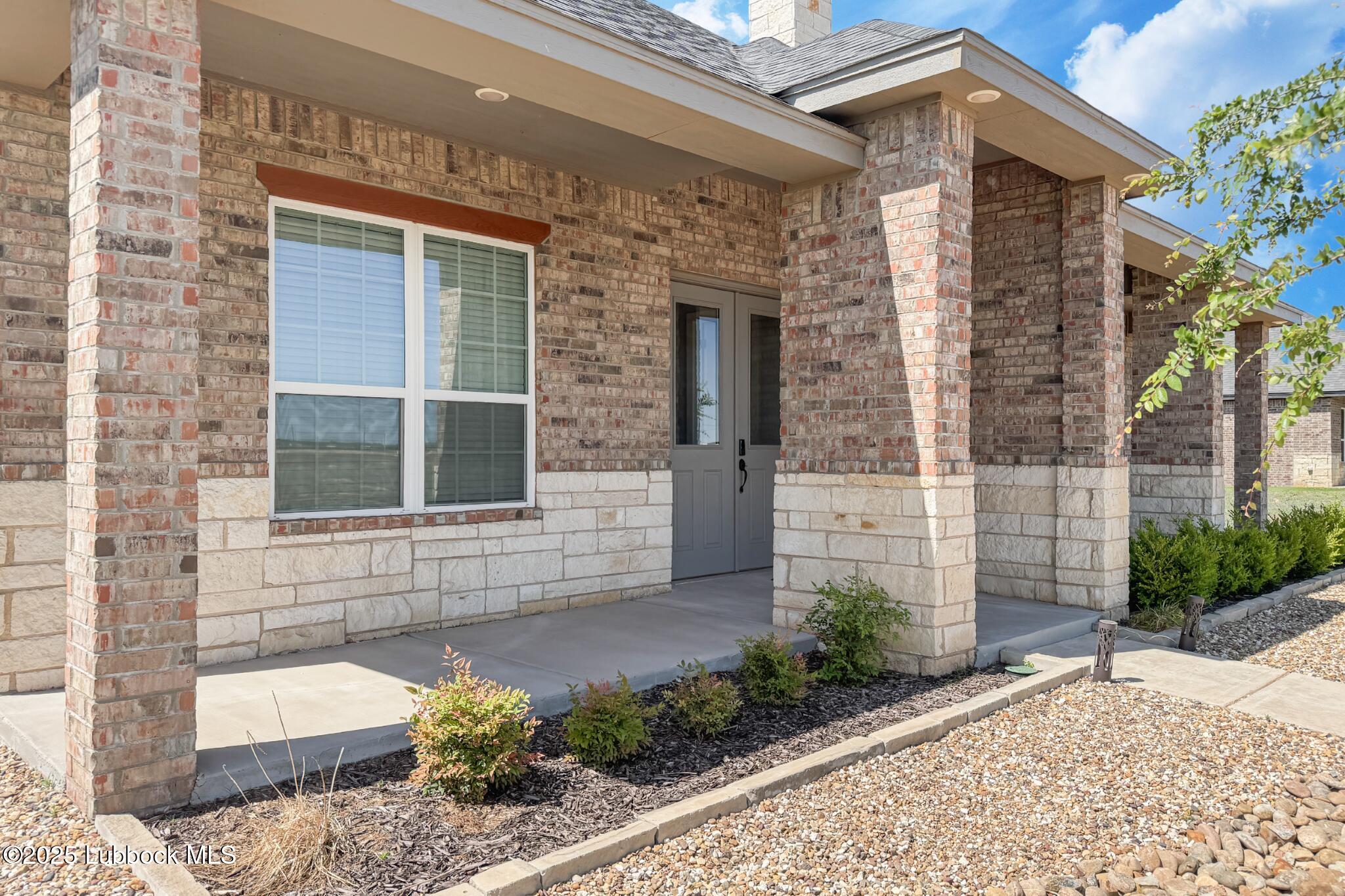 7805 52nd Street Lubbock, TX 79407 - Photo 3 of 32 a front view of a house