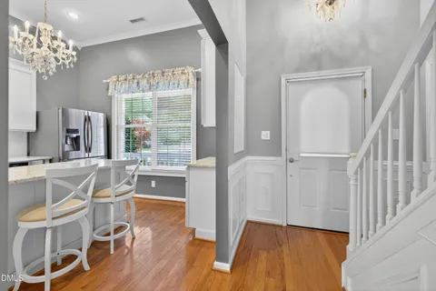 a view of a room with wooden floor and windows