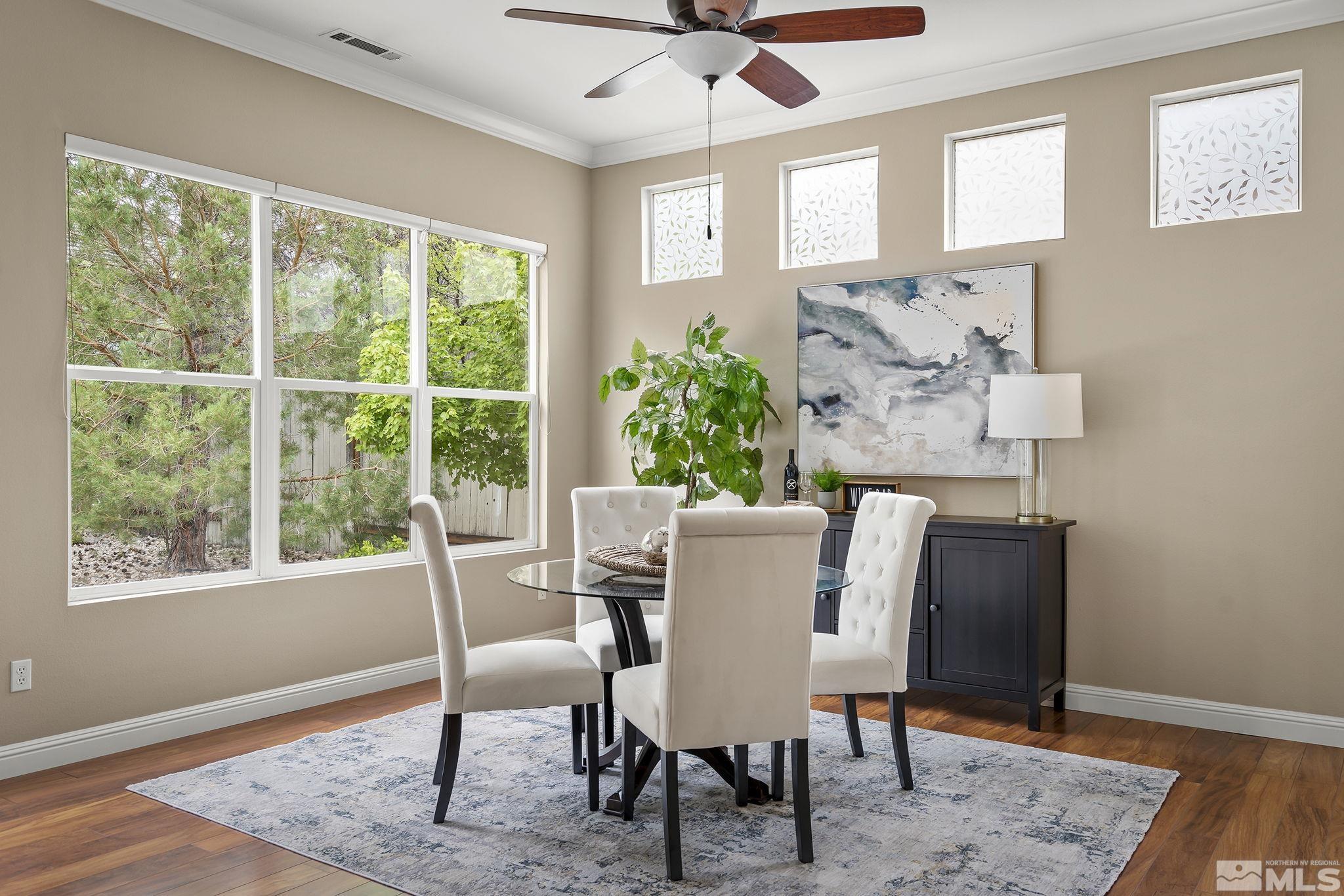 1575 Sutterbrook Way Reno, NV 89521 - Photo 11 of 21 a view of a dining room with furniture window and wooden floor
