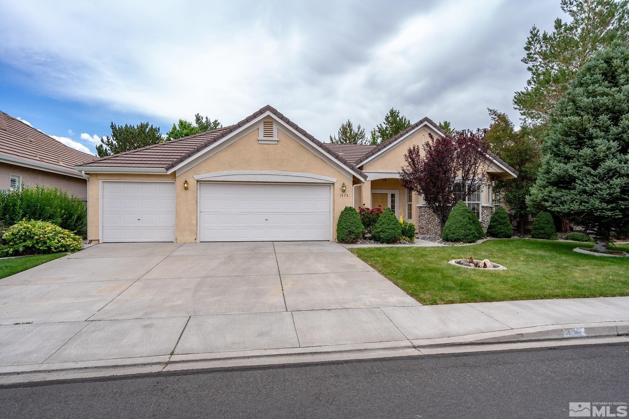 1575 Sutterbrook Way Reno, NV 89521 - Photo 2 of 21 a front view of house with yard and green space