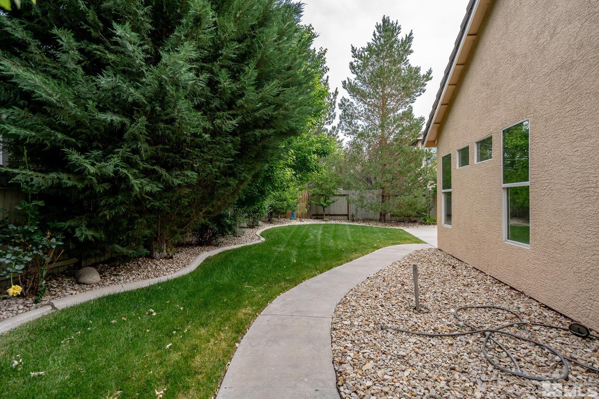 1575 Sutterbrook Way Reno, NV 89521 - Photo 21 of 21 a view of a backyard with a garden