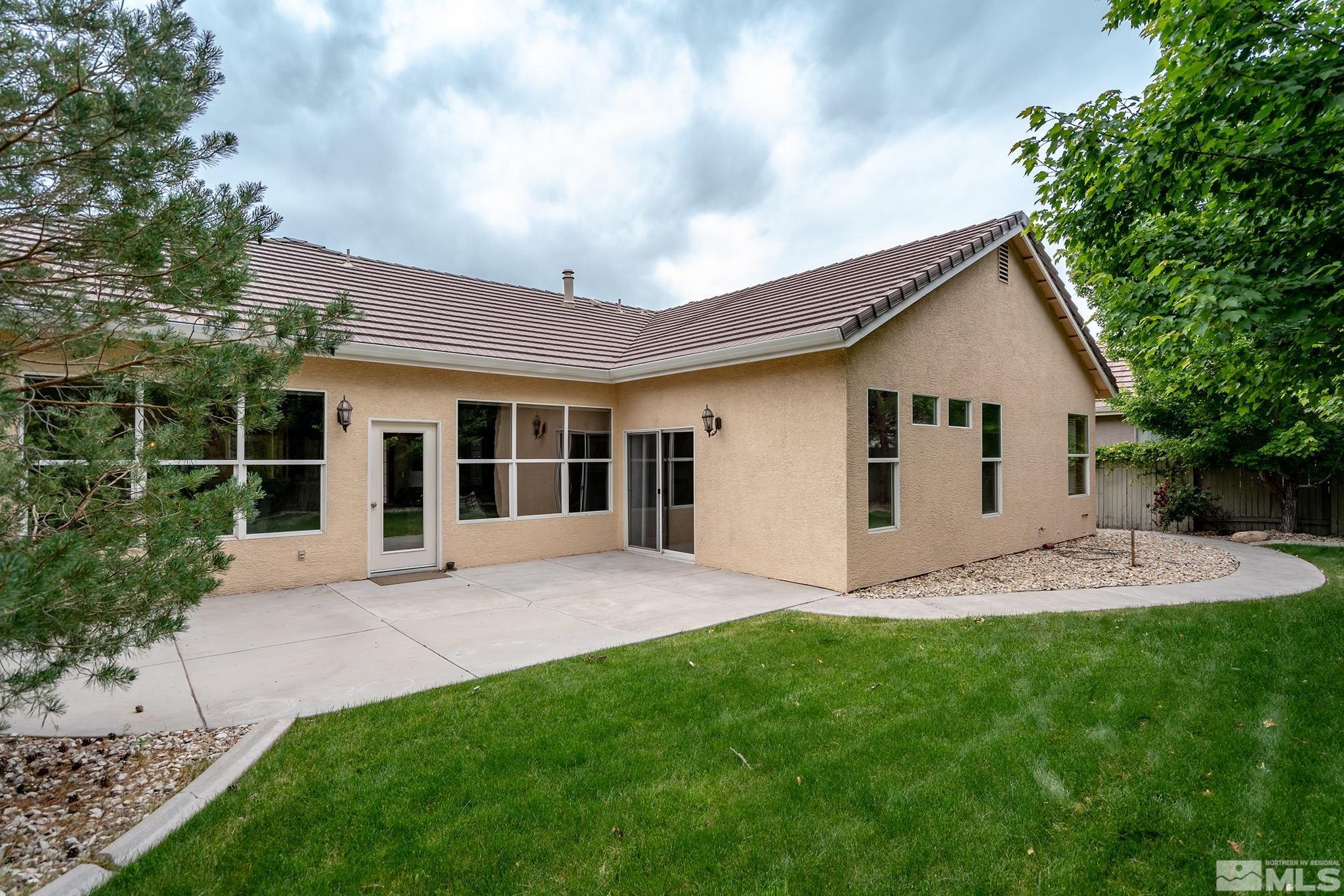 1575 Sutterbrook Way Reno, NV 89521 - Photo 3 of 21 a front view of house with yard and green space