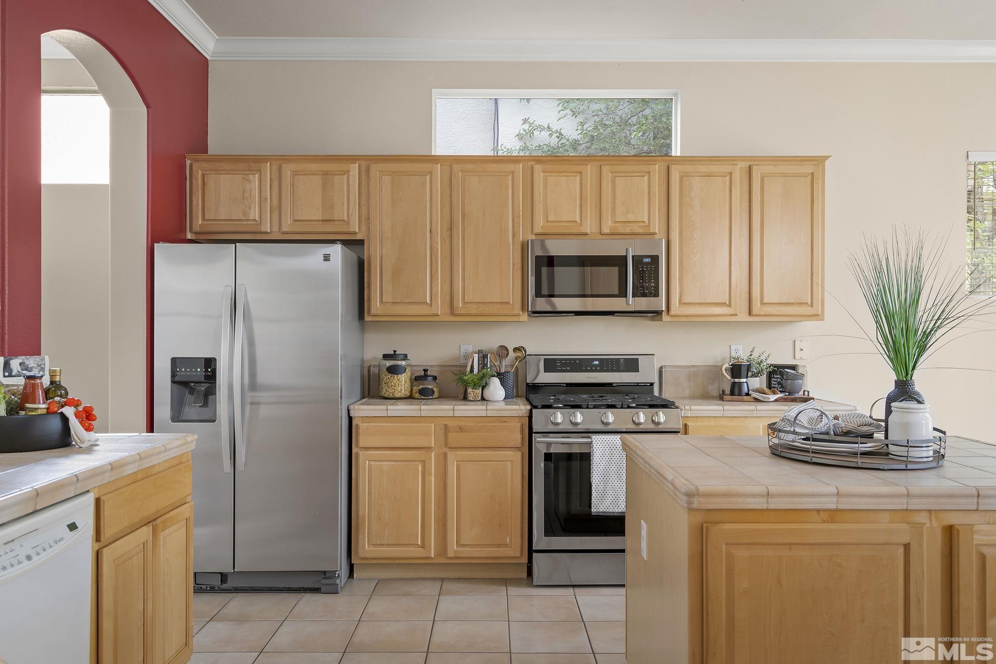 1575 Sutterbrook Way Reno, NV 89521 - Photo 10 of 21 a kitchen with a stove a sink and a refrigerator