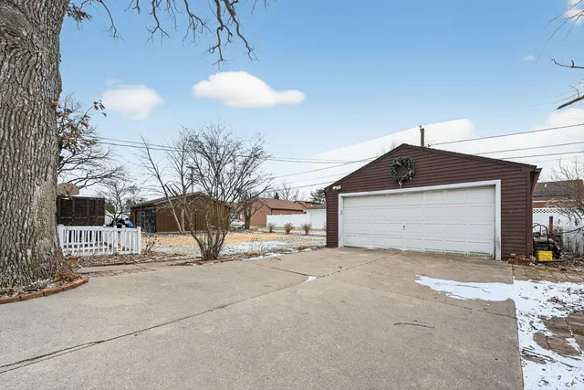 a view of a house with a snow in front of it