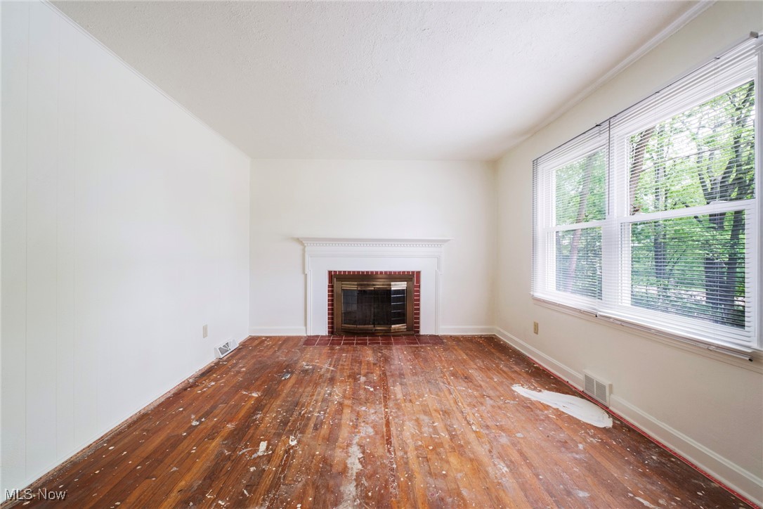 708 South Meridian Road Youngstown, OH 44515 - Photo 17 of 43 living room NOW HAS NEW CARPET featuring wood-type flooring, a fireplace, and baseboards