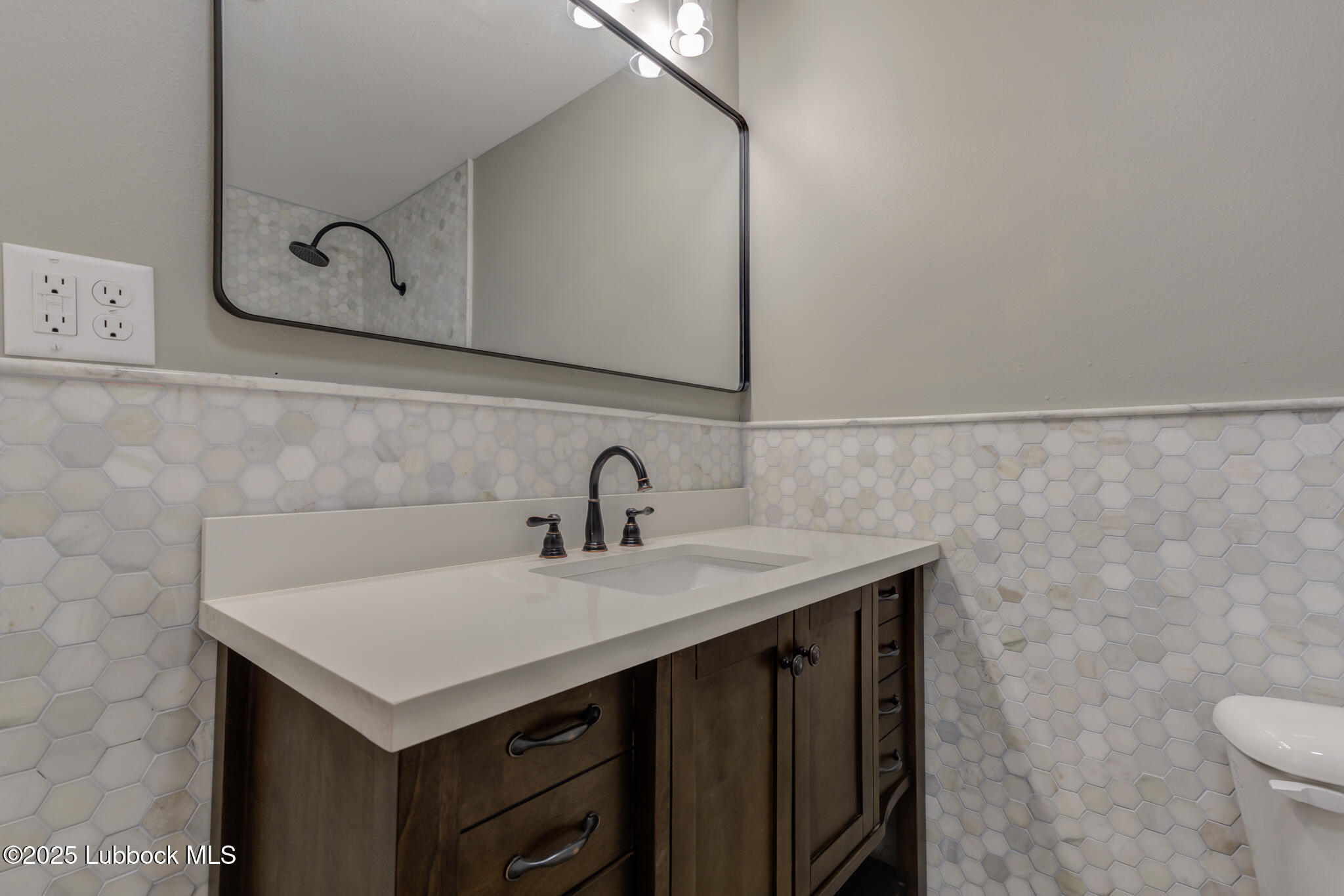 2803 West 18th Plainview, TX 79072 - Photo 26 of 32 a bathroom with a sink and a toilet