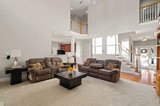 a bedroom with furniture and wooden floor