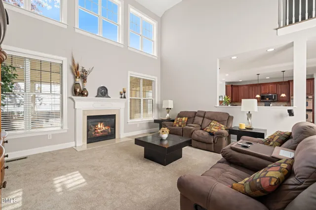 a view of a dining room with furniture wooden floor and chandelier
