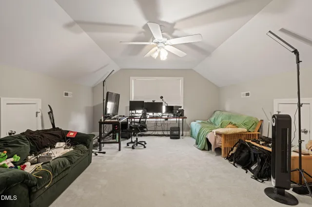 a view of a livingroom with furniture and a window