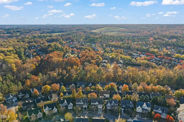 a view of a house with wooden fence
