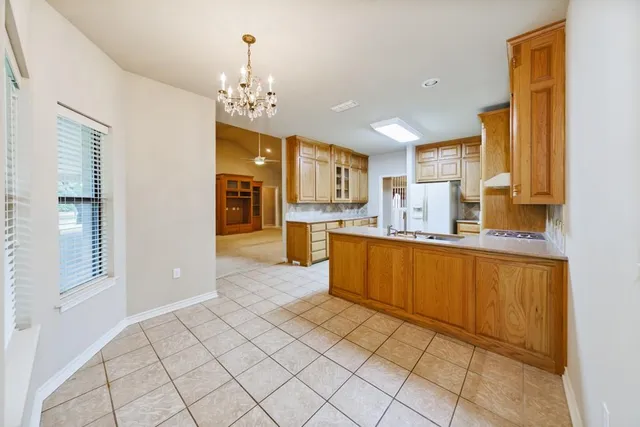 a kitchen with a sink and cabinets