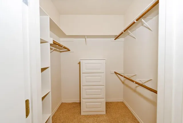 a view of an empty walk in closet