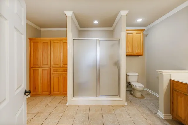 a bathroom with a toilet sink and a mirror