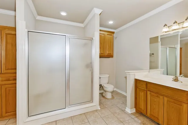 a bathroom with a sink a mirror and a shower