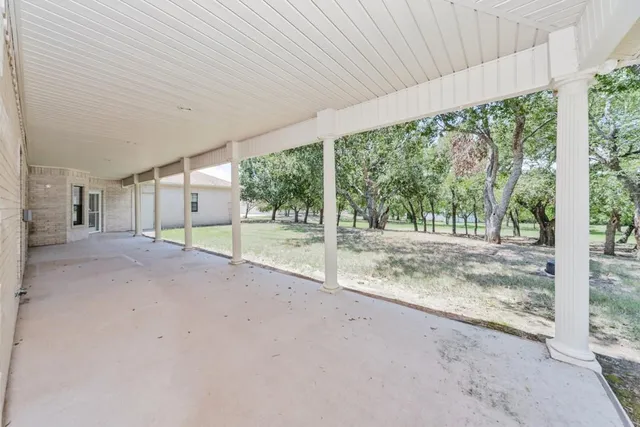 a view of a livingroom with a fireplace and cabinets