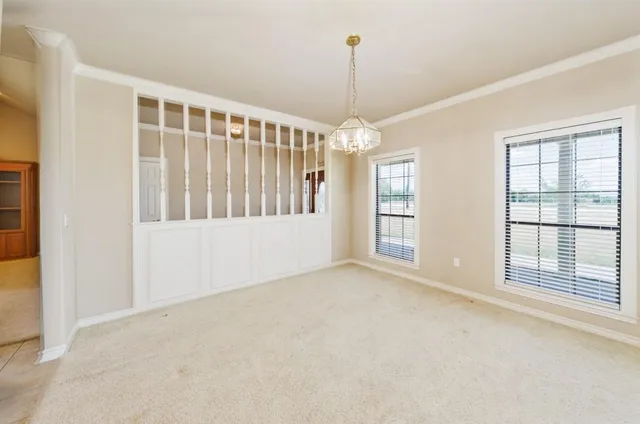 a kitchen with stainless steel appliances granite countertop a refrigerator a stove and white cabinets with wooden floor