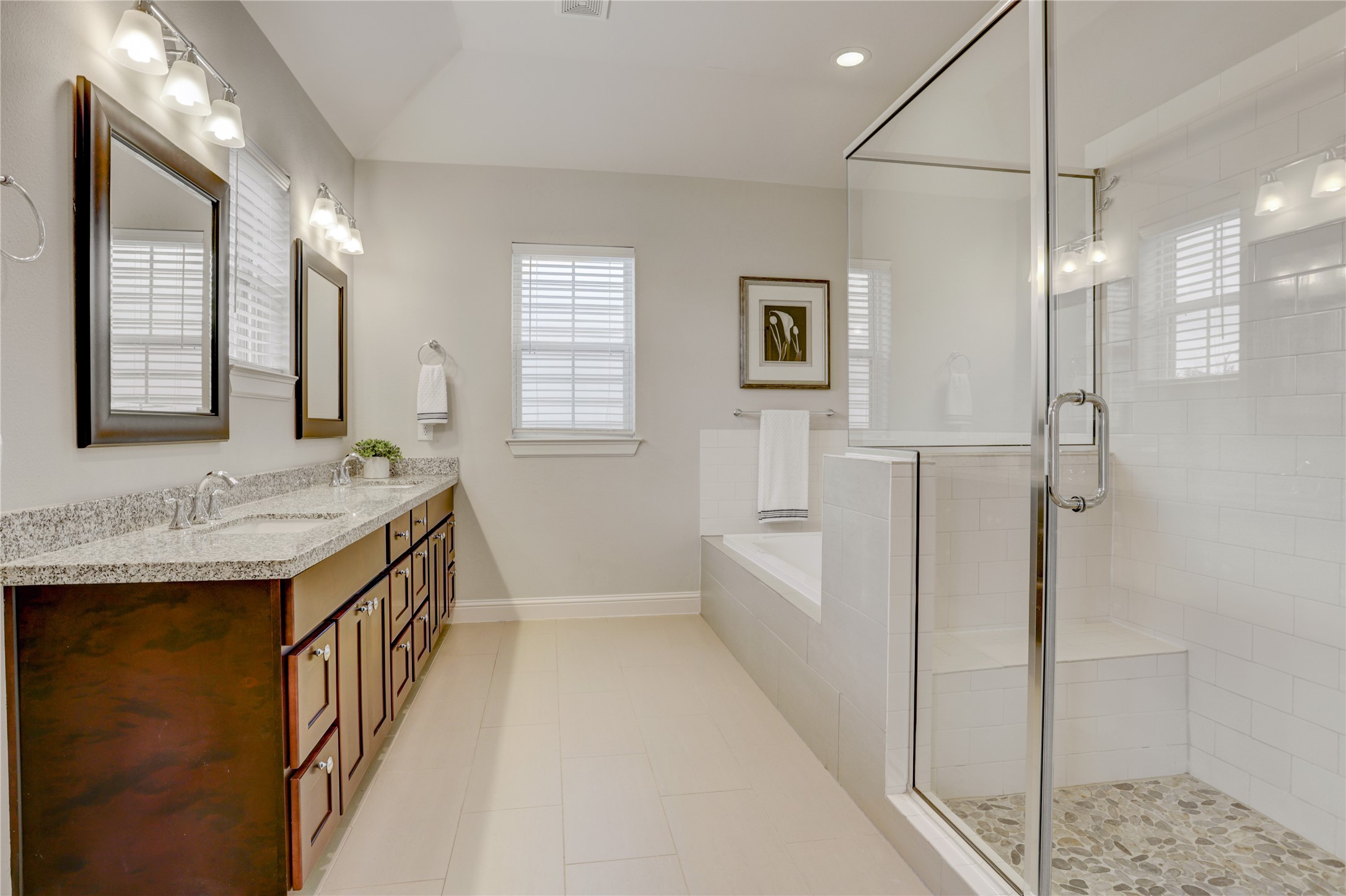 5637 Kiam Street, Unit D Houston, TX 77007 - Photo 10 of 12 a bathroom with a granite countertop sink a mirror and a shower