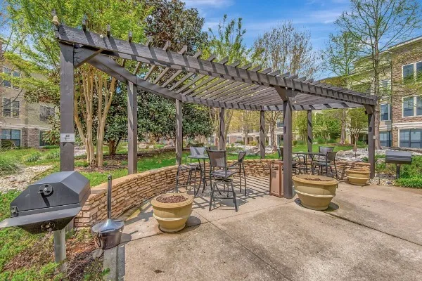 a view of a patio with a dining table and chairs