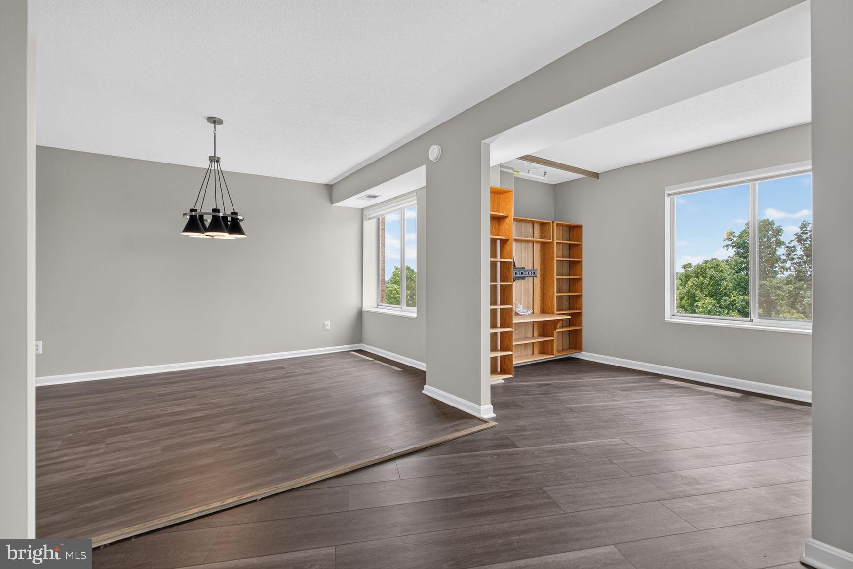 19385 Cypress Ridge Terrace, Unit 903 Leesburg, VA 20176 - Photo 10 of 37 From living room, to the dining room and den