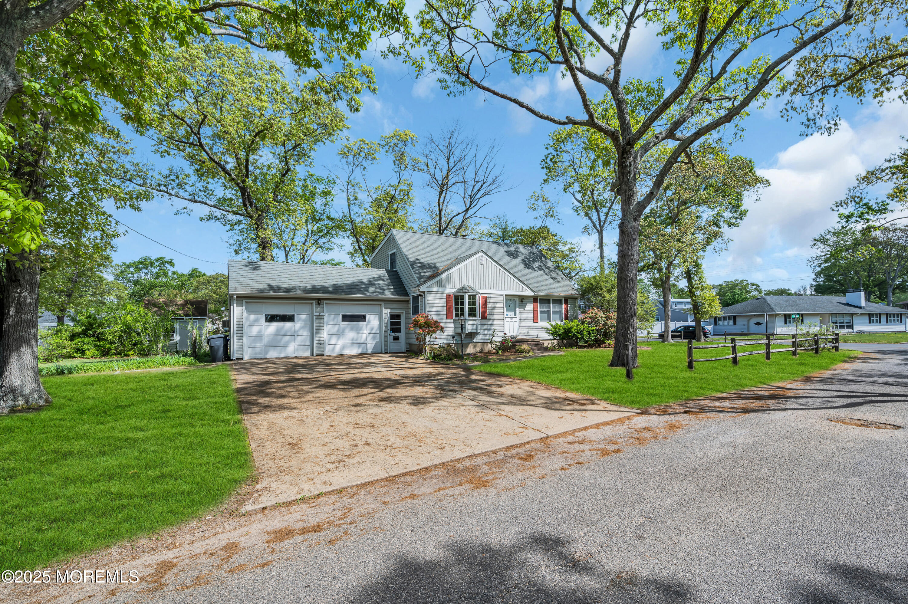 640 Thoroughfare Road Brick, NJ 08724 - Photo 1 of 48 a view of road with house and trees in the background