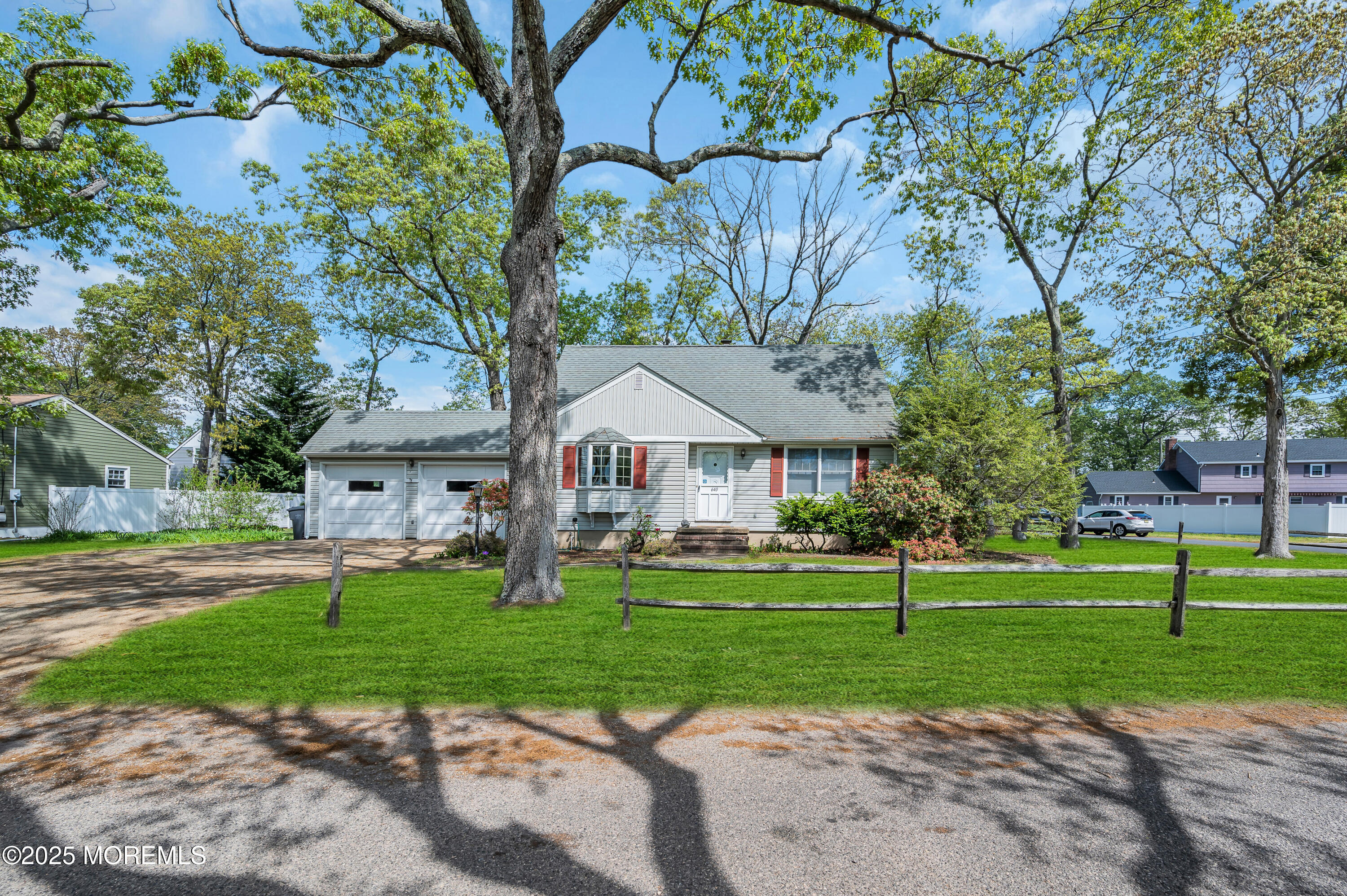 640 Thoroughfare Road Brick, NJ 08724 - Photo 3 of 48 a view of a big house with a big yard and palm trees