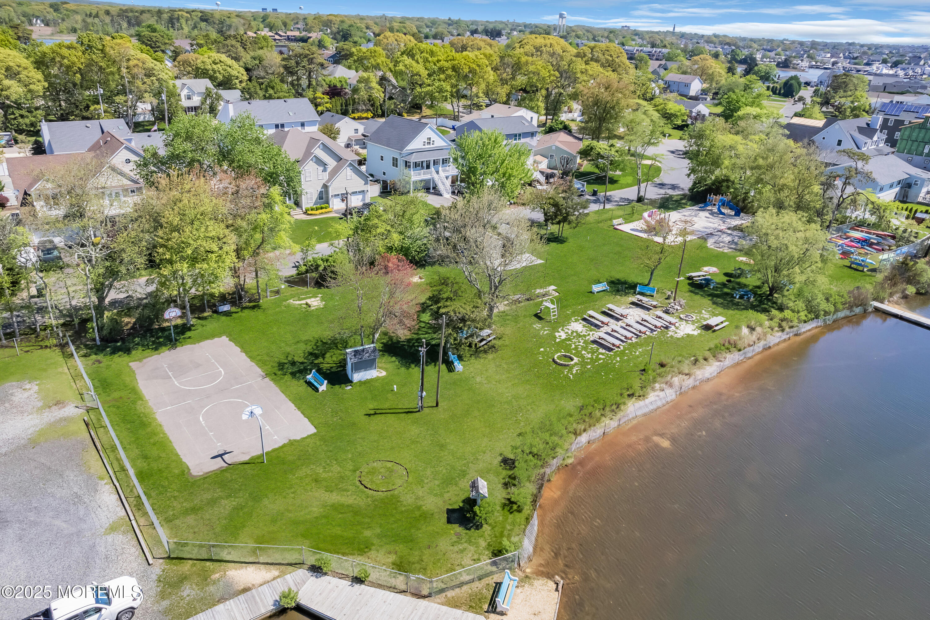 640 Thoroughfare Road Brick, NJ 08724 - Photo 36 of 48 an aerial view of a house with a yard and lake view