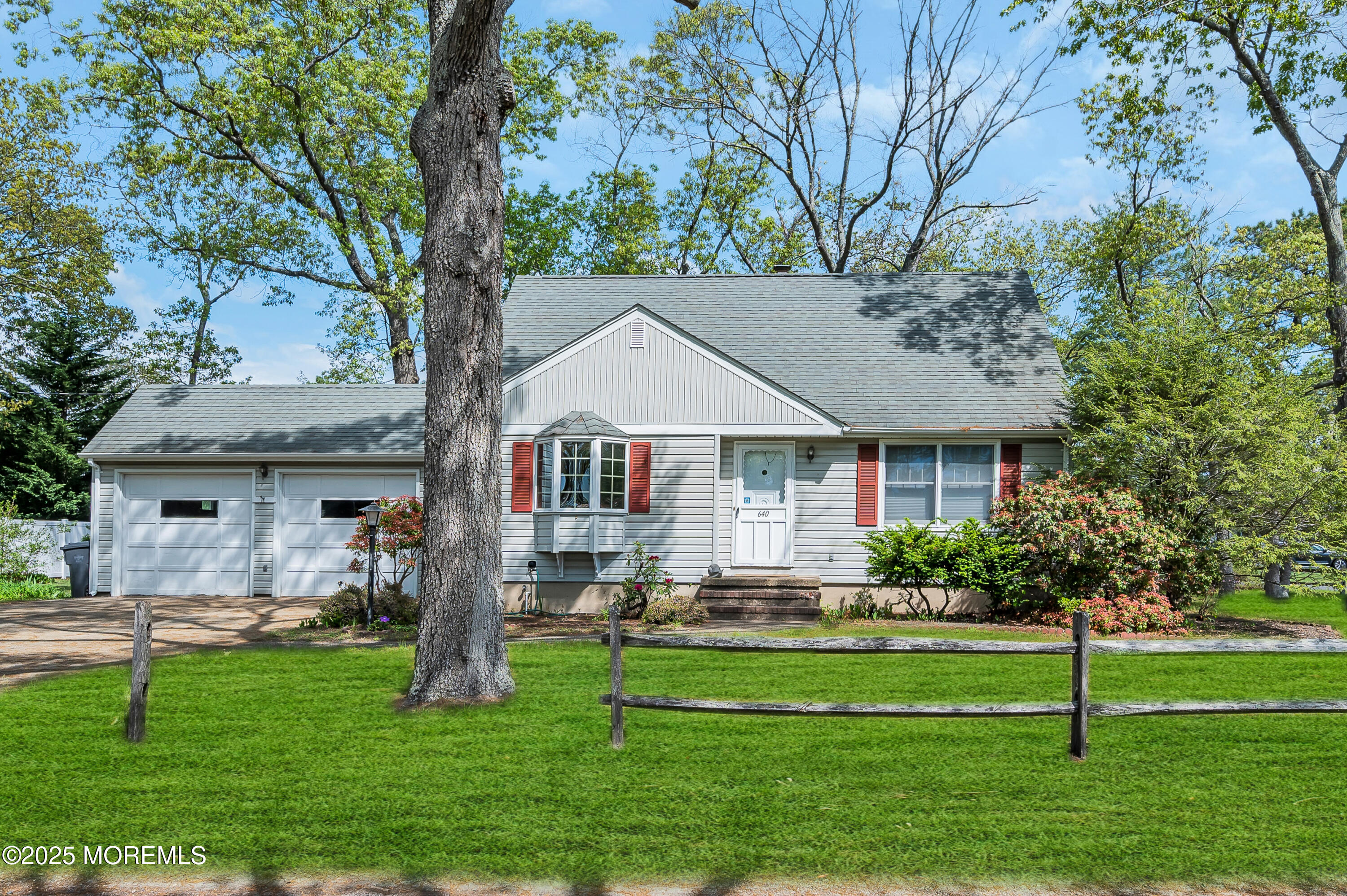 640 Thoroughfare Road Brick, NJ 08724 - Photo 4 of 48 a front view of house with yard and green space