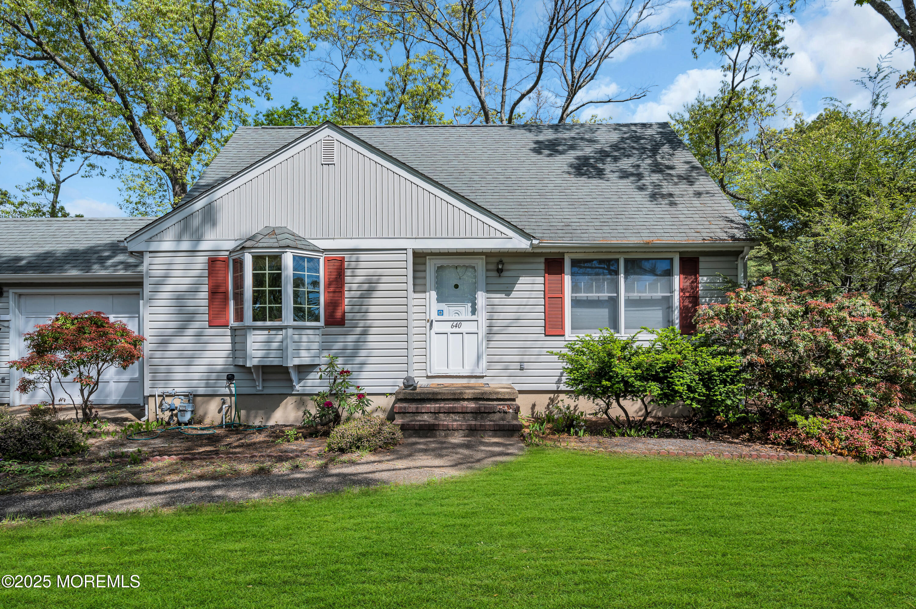 640 Thoroughfare Road Brick, NJ 08724 - Photo 5 of 48 a front view of house with yard and green space