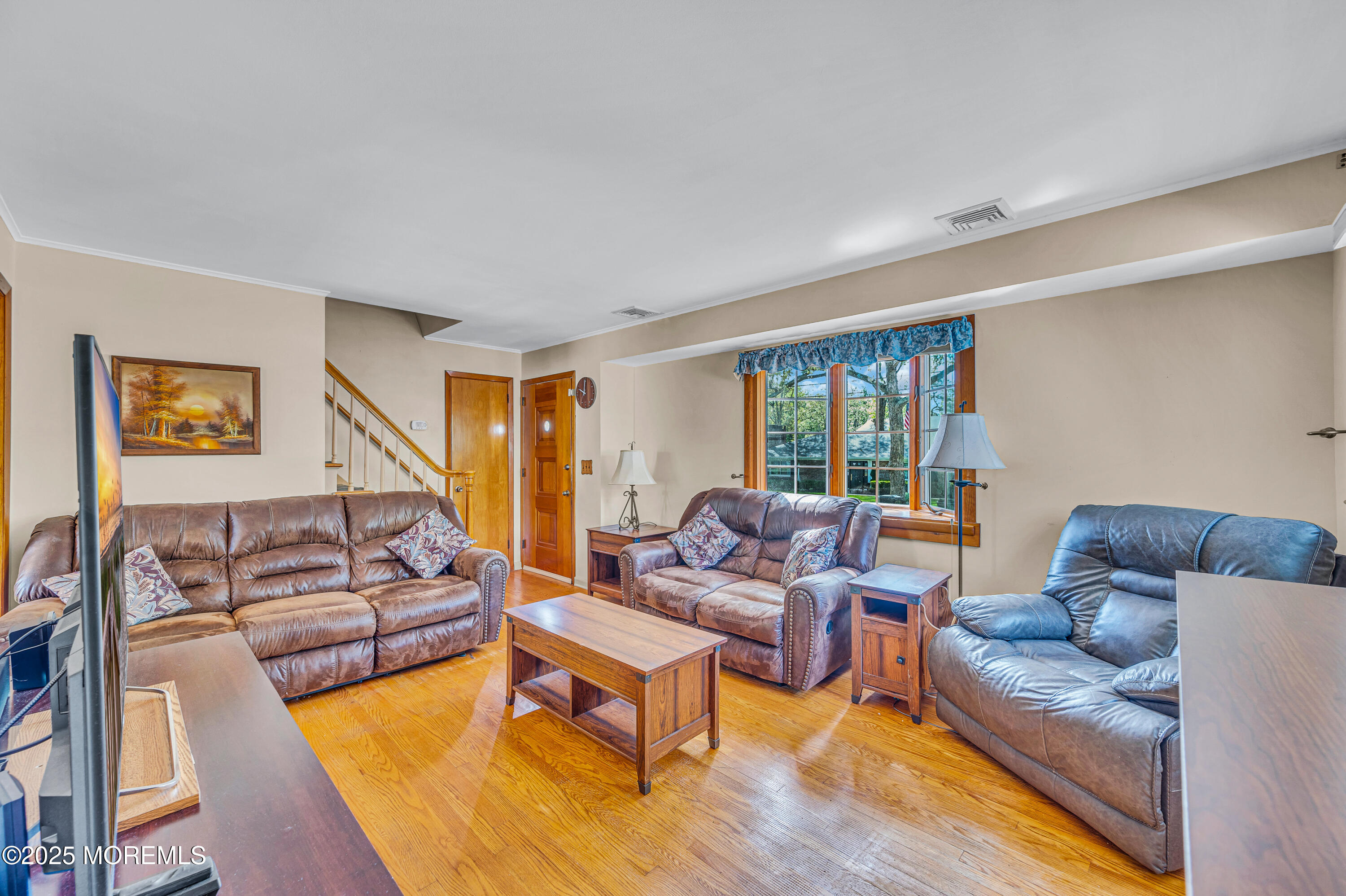 640 Thoroughfare Road Brick, NJ 08724 - Photo 7 of 48 a living room with furniture and a flat screen tv