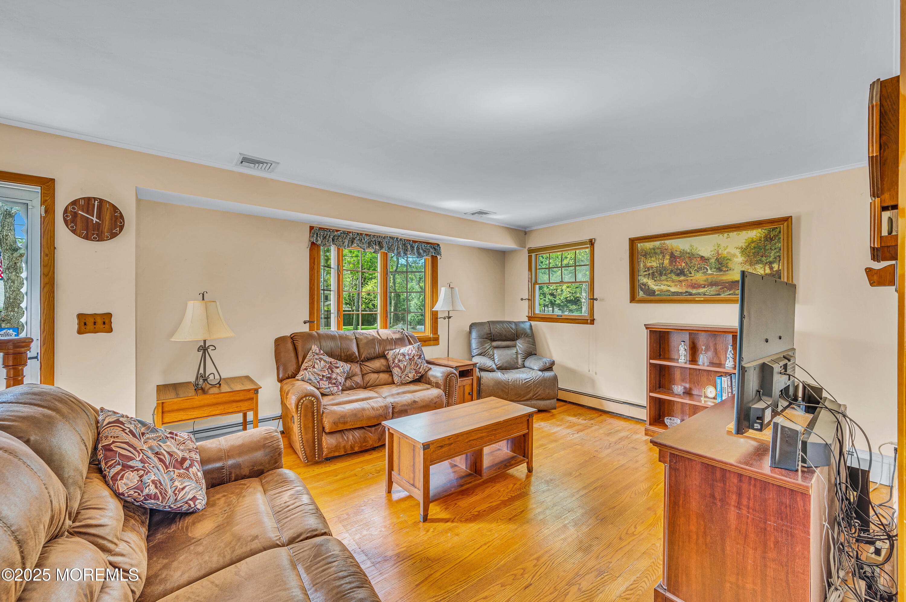 640 Thoroughfare Road Brick, NJ 08724 - Photo 8 of 48 a living room with furniture and a flat screen tv