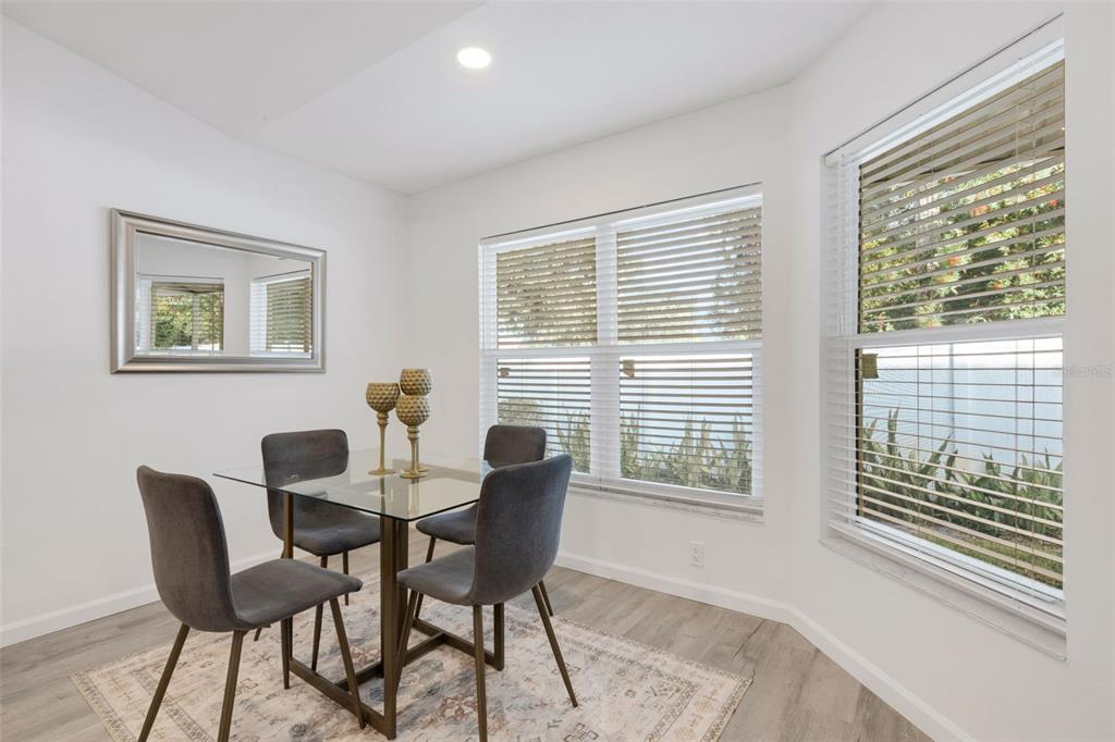 606 Marcus Street, Unit 26 Venice, FL 34285 - Photo 13 of 42 a dining room with furniture and window
