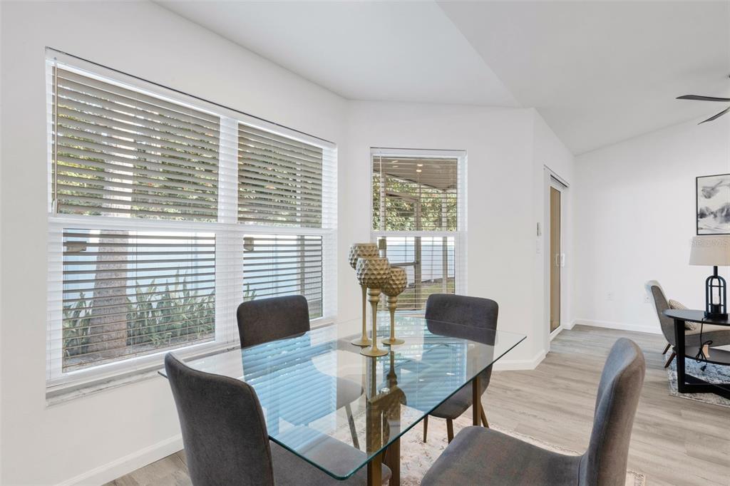 606 Marcus Street, Unit 26 Venice, FL 34285 - Photo 14 of 42 a view of a dining room with furniture and wooden floor
