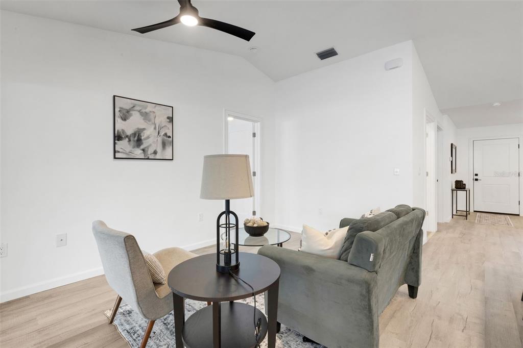 606 Marcus Street, Unit 26 Venice, FL 34285 - Photo 16 of 42 a living room with furniture and a table