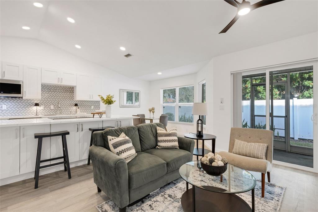 606 Marcus Street, Unit 26 Venice, FL 34285 - Photo 18 of 42 a living room with furniture and a large window