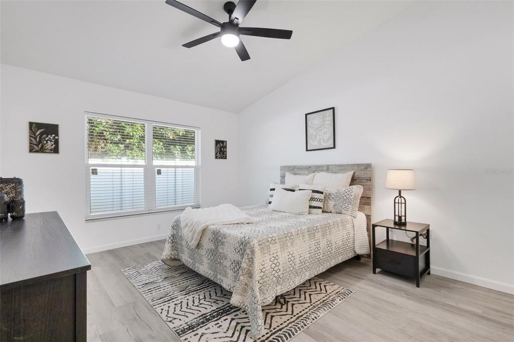 606 Marcus Street, Unit 26 Venice, FL 34285 - Photo 19 of 42 a bedroom with a large bed and a window