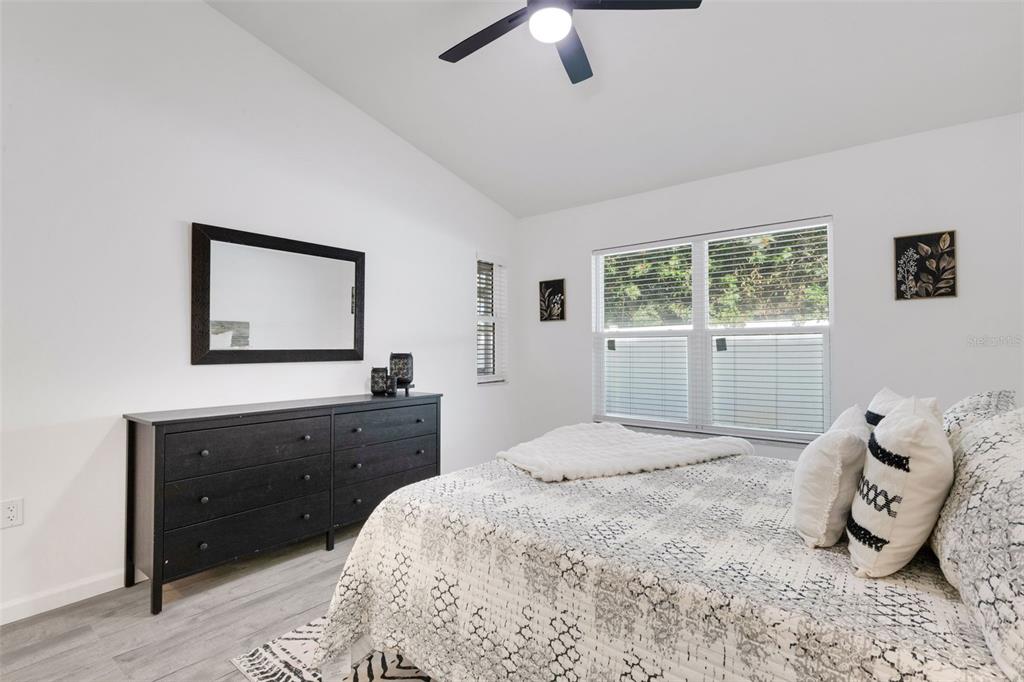 606 Marcus Street, Unit 26 Venice, FL 34285 - Photo 20 of 42 a bedroom with a bed and window
