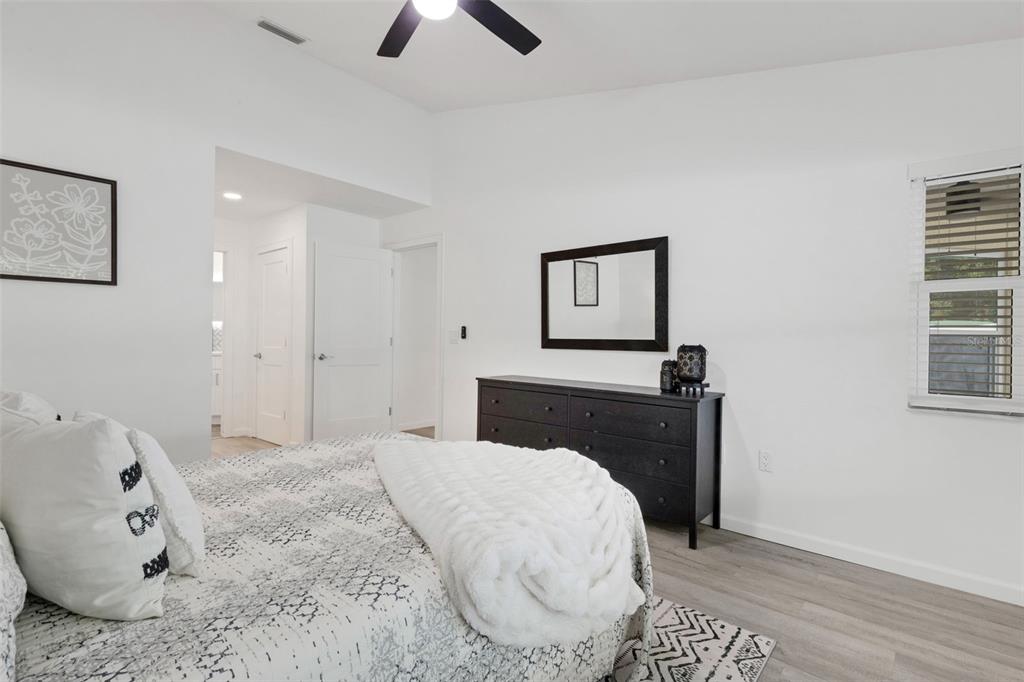 606 Marcus Street, Unit 26 Venice, FL 34285 - Photo 22 of 42 a bedroom with a bed and a window