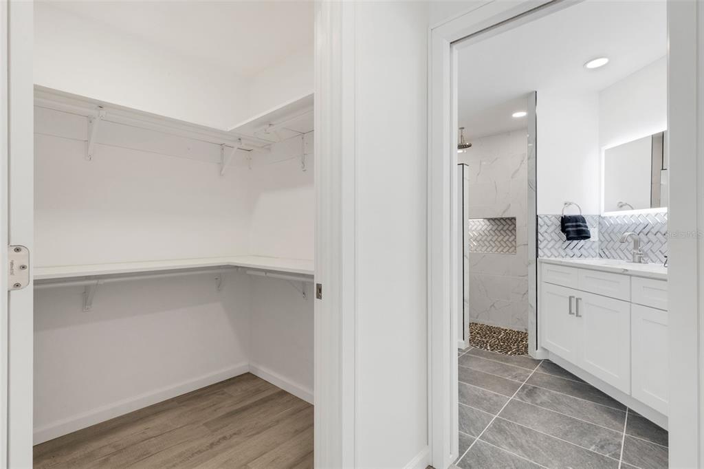 606 Marcus Street, Unit 26 Venice, FL 34285 - Photo 23 of 42 a bathroom with a shower sink and mirror
